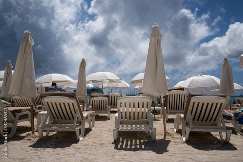 beach chairs and umbrellas on the beach photo