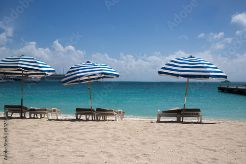 beach with umbrella in St. Maarten caribbean island