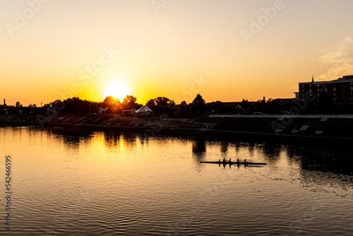 Sunrise Over A River With A Boat © Andrew