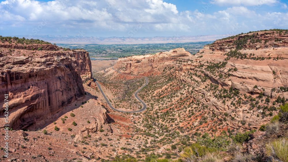 View of the Fruita Canyon Rimrock Drive entrance road Colorado National Monument in Grand Junction - Grand Valley overlook View of the Fruita Canyon Rimrock Drive entrance road Colorado National Monument in Grand Junction - Grand Valley overlook