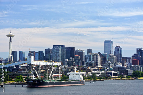 Seattle, Washington: View of the Seattle skyline and a cargo ship in Elliott Bay, from the Smith Cove Cruise Terminal at Pier #91.