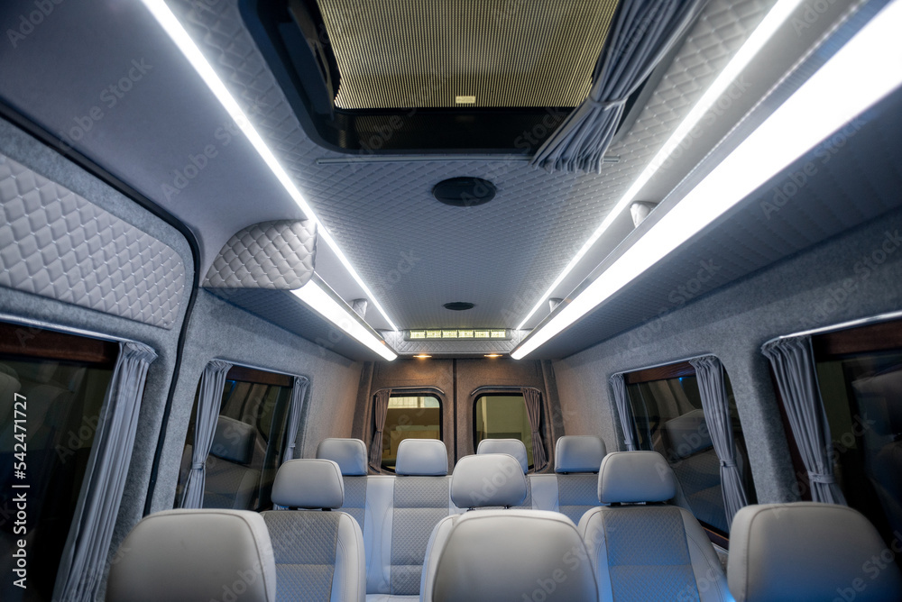 comfortable passenger bus interior with upholstered seats
