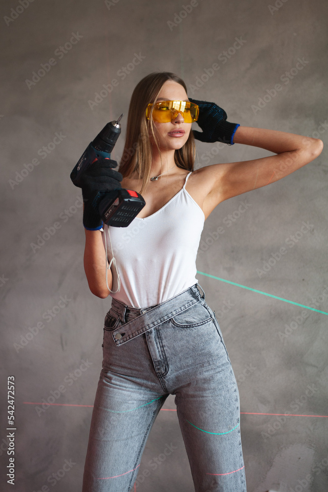 beauty blonde girl with construction tools