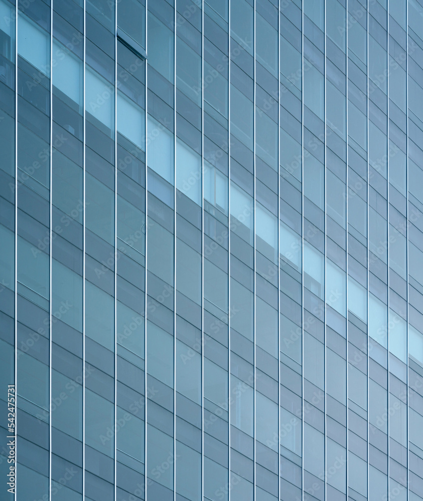 close-up soft light pattern glass wall facade exterior architecture building reflection blue sky clean environment background. modern business office concept,smart city backdrop cover minimal design. close-up soft light pattern glass wall facade exterior architecture building reflection blue sky clean environment background. modern business office concept,smart city backdrop cover minimal design.