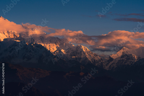 First ray of morning sun on the peaks of majestic Kangchenjunga mountain range (third highest in the World) of Himalayas. Photo taken from Sandakphu, West Bengal.