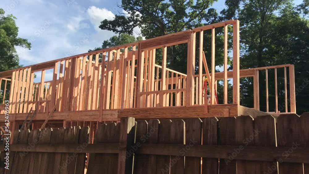 house building construction site with wood beams and timber in North America house building construction site with wood beams and timber in North America