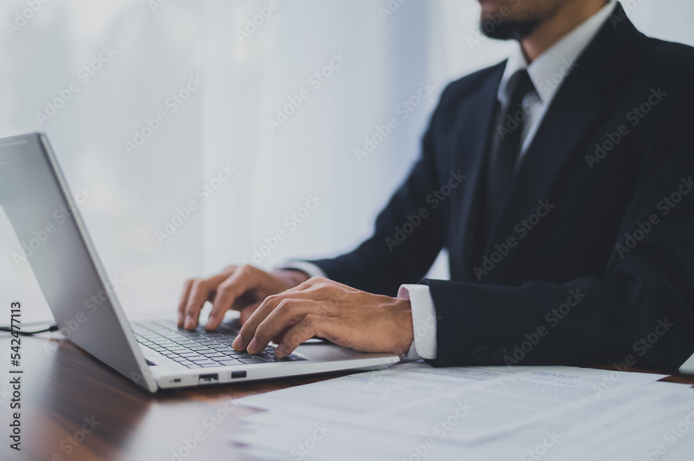 Business man using computer working in office Business man using computer working in office