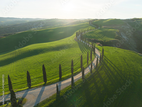 tuscany fields and roads from aerial view at sunrise photo