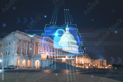 Front view, Capitol dome building at night, Washington DC, USA. Illuminated Home of Congress and Capitol Hill. The concept of cyber security to protect confidential information, padlock hologram photo