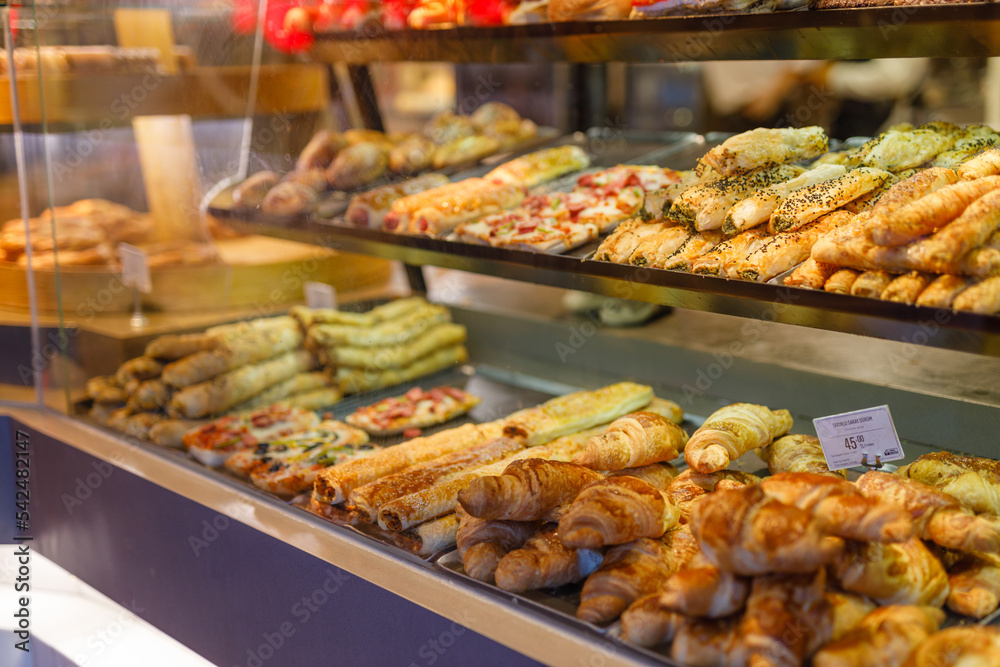 Traditional Turkish dessert Baklava close-up trays of delicious baklava displayed in showcase of baklavalari cafe