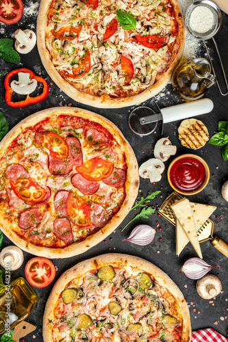 Set Pizza background. various kinds of Italian pizza on a dark background, Fast food lunch, vertical image. top view. place for text