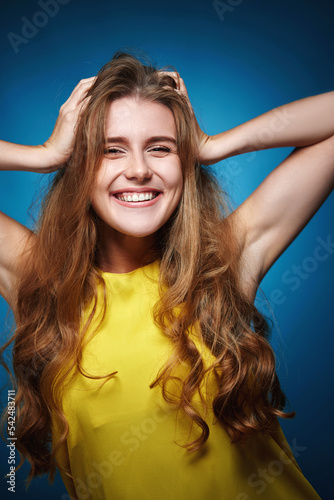 happy woman with strong healthy curly hair