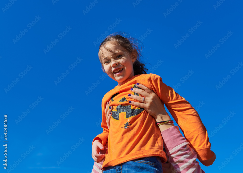 Kids playing at a farm fair on Halloween Kids playing at a farm fair on Halloween