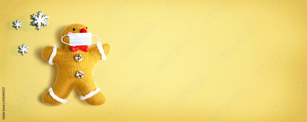 Gingerbread wearing a face mask - flat lay Gingerbread wearing a face mask - flat lay