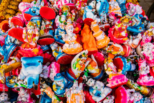 Colourful Hindu gods statues in a market
