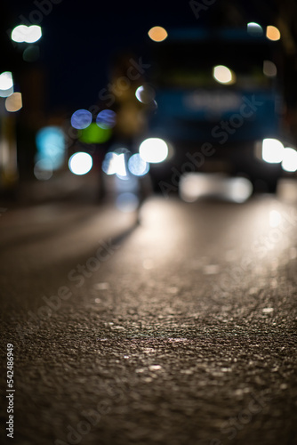 Blurred vehicle front view at night from street view