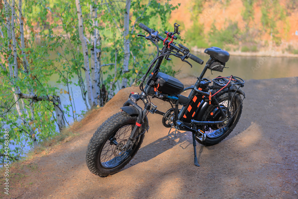 Fototapeta premium Electric Bicycle By the riverside