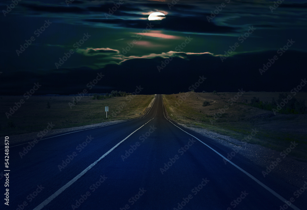 Fototapeta premium Moon in the clouds over a country road