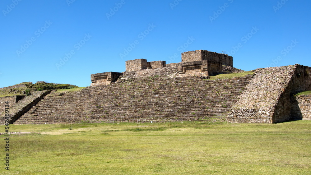Low, stepped pyramid in the ruins of Monte Alban, in Oaxaca, Mexico