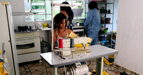 Entrepreneur black woman working from home knitting on machine3