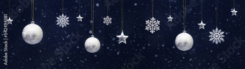 Christmas celebration holiday background banner template greeting card panorama - Group of hanging white balls baubles  ice crystals and silver stars on dark blue snowy night sky  with snowflakes