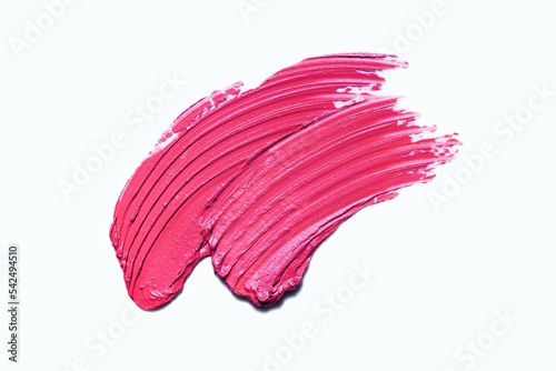 Cosmetic matte red pink lipstick smudge texture on white isolated background © tatyanarow