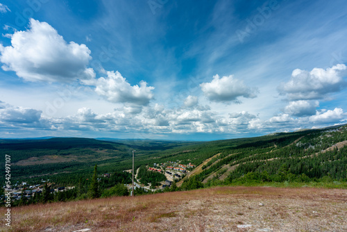 Photos Beautiful summer view from mountain top with blue sky and the village Vemdalen in the valley