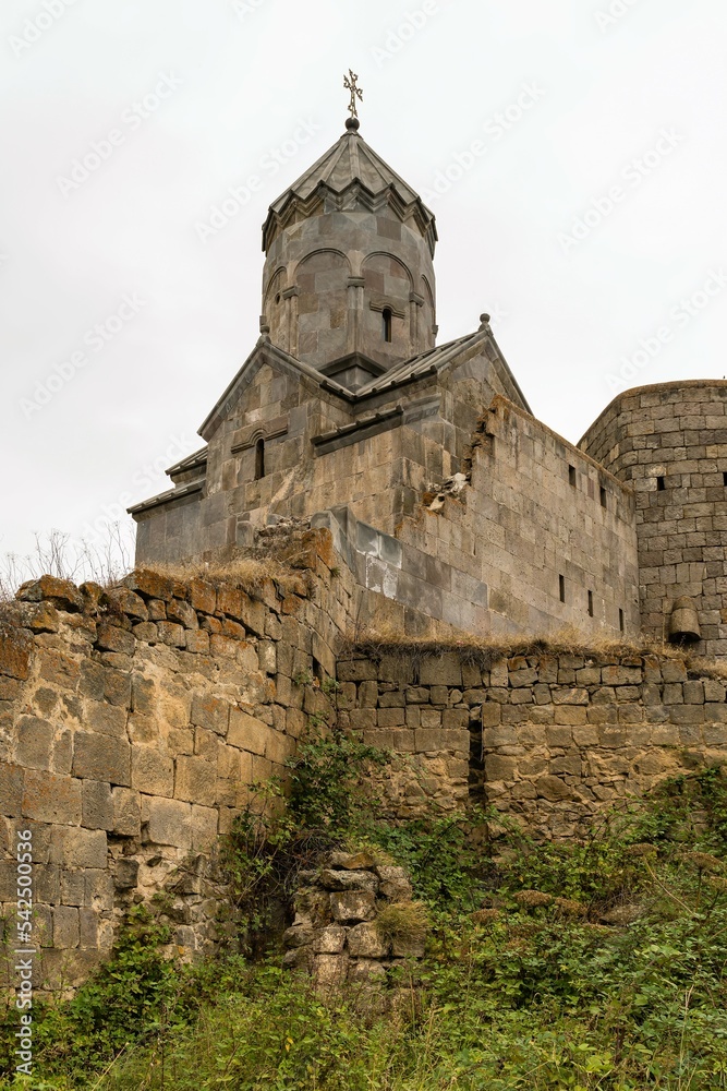 Armenia, Tatev, September 2022. View of the temple of St. Minas from behind the wall of the monastery.