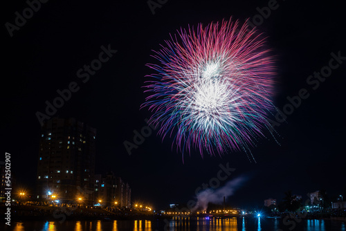fireworks over the river in the city