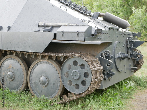 German light self-propelled artillery installation of the Second World War. An armored vehicle with a camouflage dark gray color on a forest road. photo