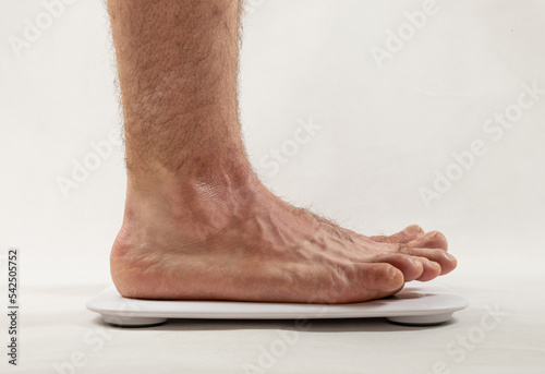 Bare Feet on Weight Scale, Overweight Control, Obese Problem, Lost Weight Concept