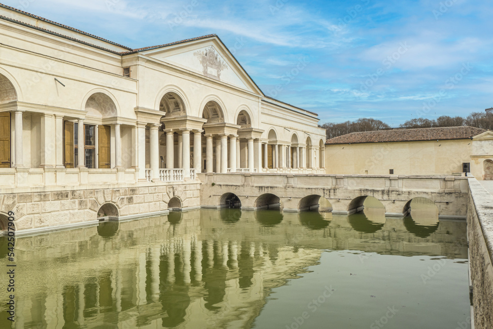The beautiful facade of the famous Palazzo Te in Mantua reflecting on the water