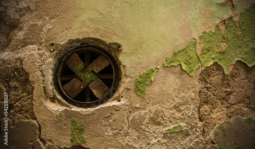 An old air vent with fan in a derelict building in the historic centre of Piran on the coast of Slovenia
 #542510527