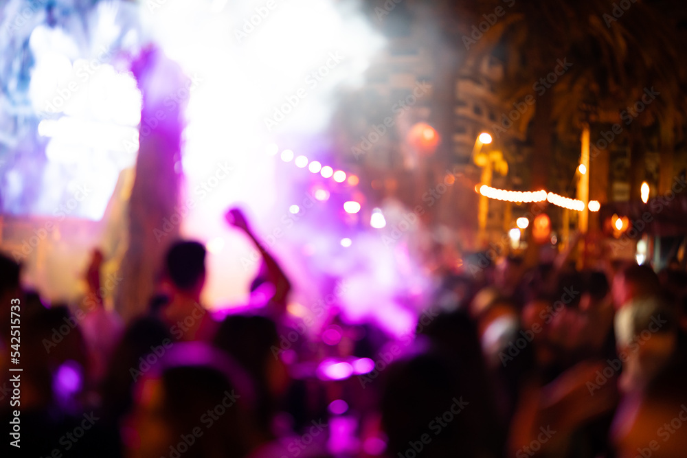 Blurred photo of people at a night disco.