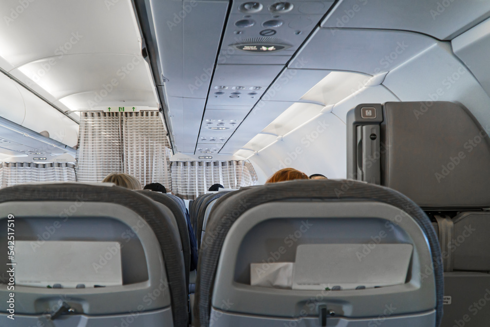 Obraz premium Interior inside of the plane with passengers.
