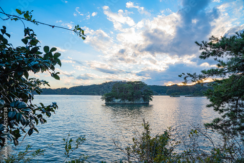 Matsushima Bay in dusk, beautiful islands covered with pine trees and rocks. One of the Three Views of Japan, and is also the site of the Zuigan-ji, Entsu-in and Kanrantei. in Miyagi Prefecture, Japan photo