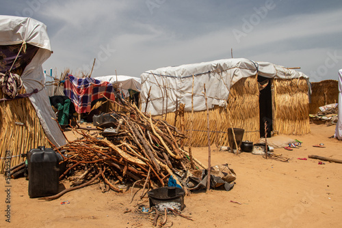 Refugee camp in Africa, full of people who took refuge due to insecurity and armed conflict. People living in very poor conditions, lack of food, clean water and proper shelter to stay in photo
