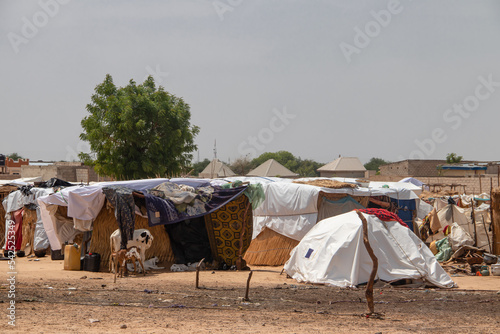 Refugee camp in Africa, full of people who took refuge due to insecurity and armed conflict. People living in very poor conditions, lack of food, clean water and proper shelter to stay in photo
