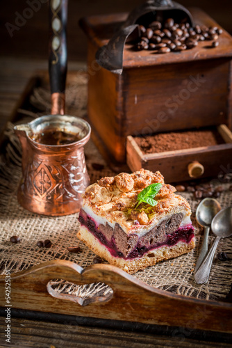 Tasty and homemade cherry pie with pot boiled coffee