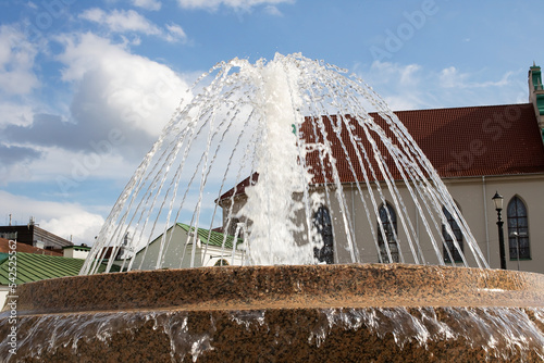 Jet of water in the fountain, green dirty water photo