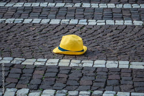 Hat Lying On Cobblestone Street