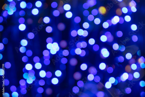 Christmas background with bokeh of colored lights. photo