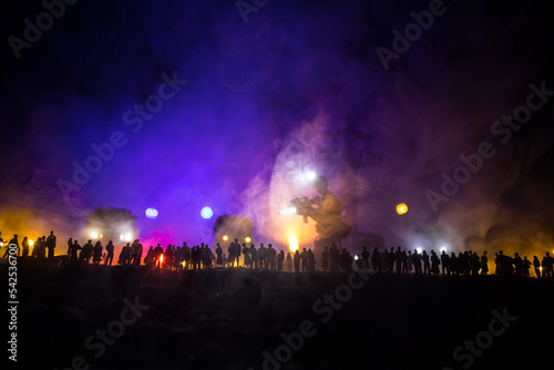 Creative artwork decoration war on Ukraine. Crowd looking on giant explosion and attacking soldiers. photo