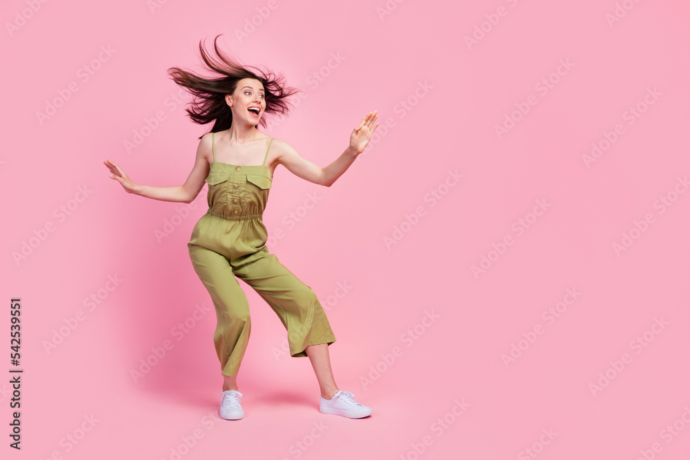 Full length photo of cheerful girl energetic active person look empty space kung fu isolated on pink color background
