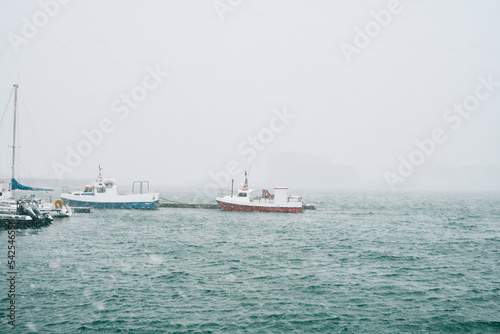 Boats floating on rippling sea