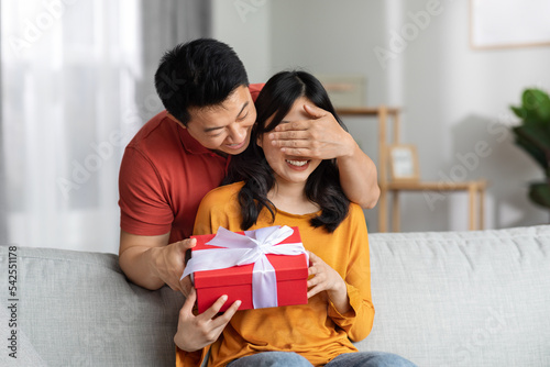 Loving man making surprise for St. Valentines Day or birthday