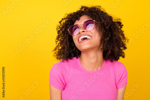 Photo of dreamy excited lady wear pink top dark eyewear laughing looking empty s Fototapeta