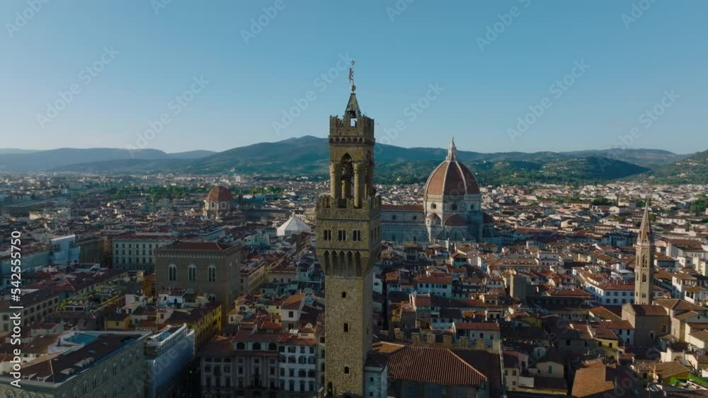 Elevated orbit shot around Palazzo Vecchio tower above historic city centre with many tourist landmarks. Florence, Italy Elevated orbit shot around Palazzo Vecchio tower above historic city centre with many tourist landmarks. Florence, Italy