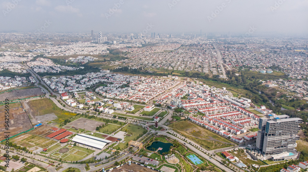 Image of Puebla, Mexico during sunrise. Panoramic aerial view of the cities of Puebla and Angelopolis.
