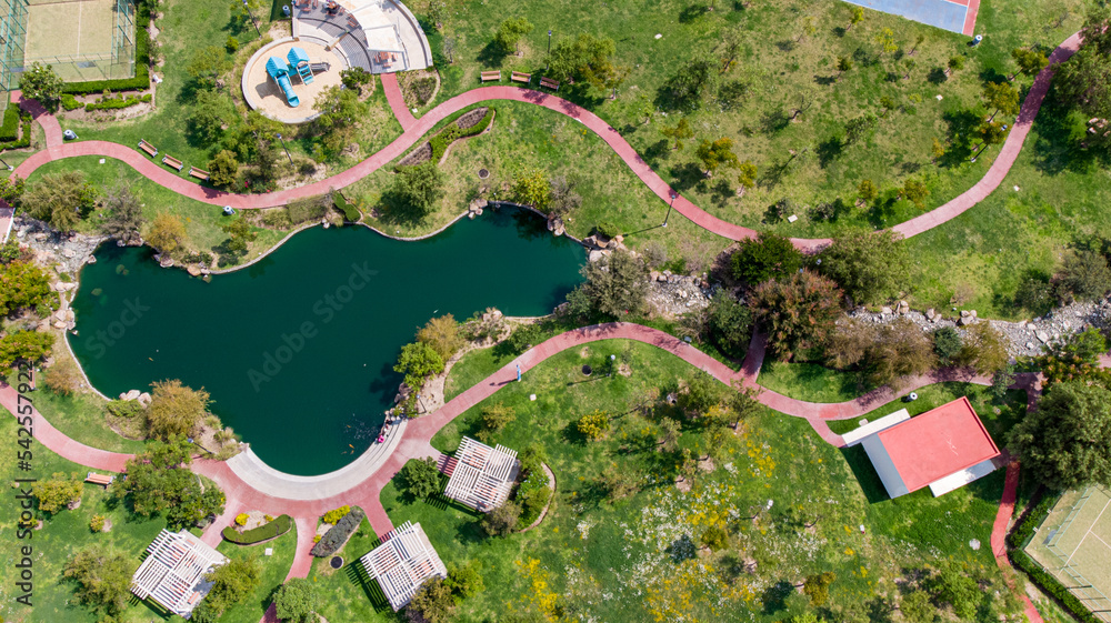 Aerial drone view of a lake in the middle of a park. aerial shot